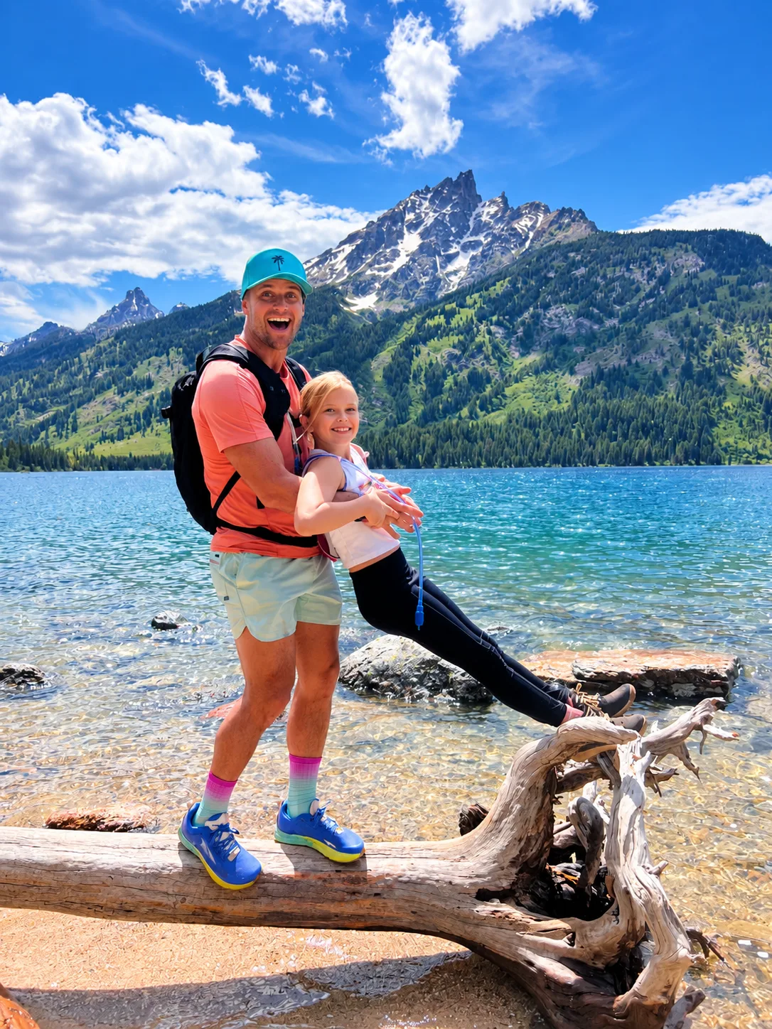 Daniel and Bentley by a mountain lake in Grand Teton