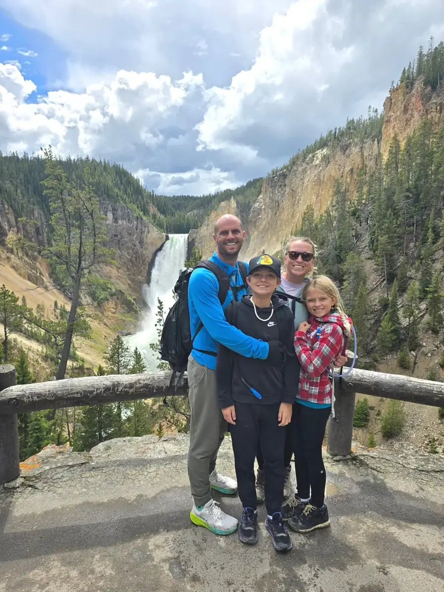 Family at a Yellowstone waterfall overlook