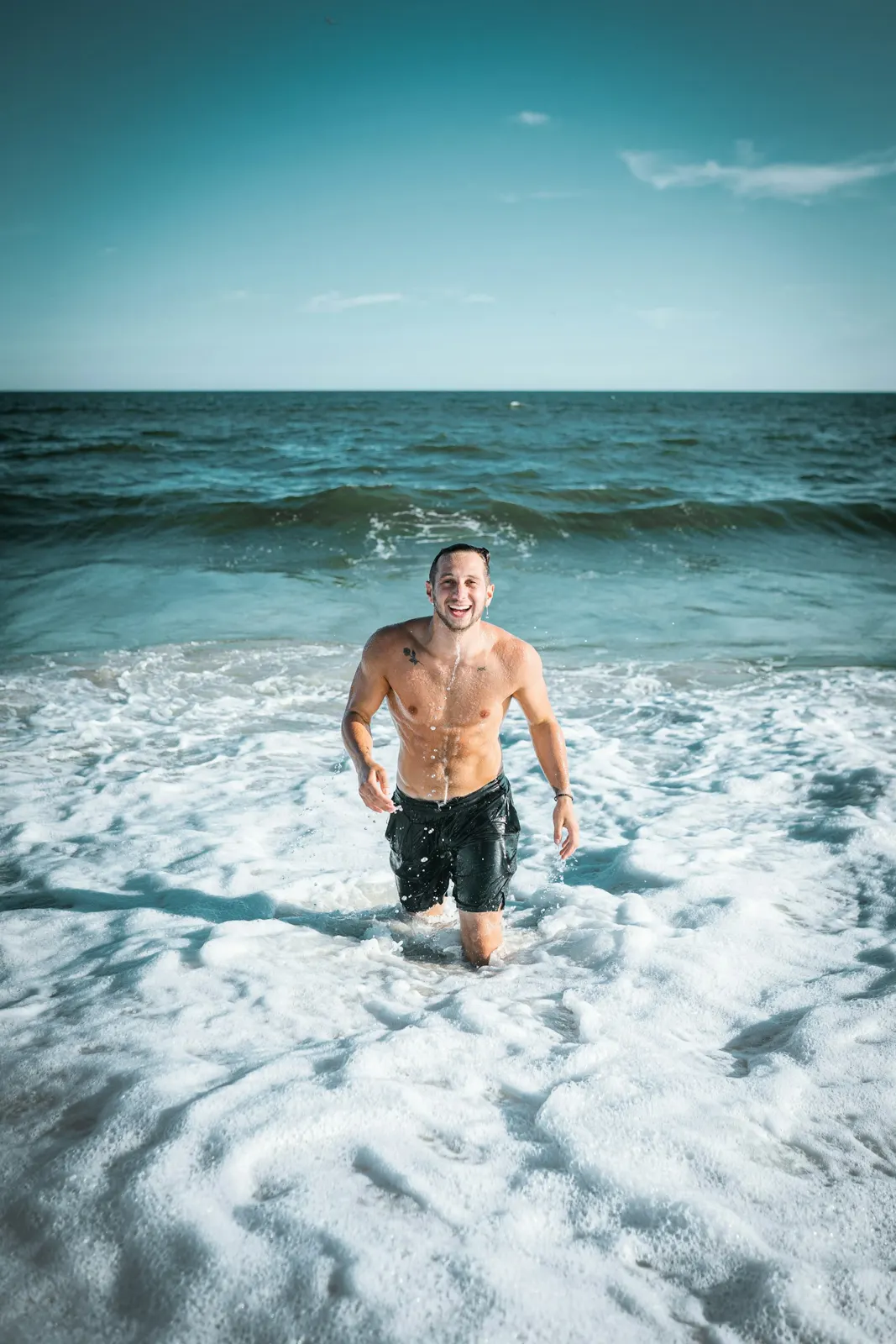 Man wading out of the surf